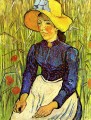 Young Peasant Girl in a Straw Hat sitting in front of a wheatfield Vincent van Gogh